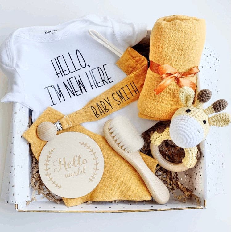 8 piece Orange Gender Neutral Baby Shower Gift Basket Set - Yellow Giraffe teething rattle, custom baby name Soother clip, personalized onesie, orange baby bib, wooden "Hello World" disk, orange baby blanket, Baby brush